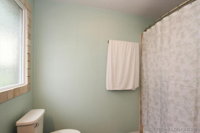 410 Shawnee St, So Coffeyville, OK 74072 - full bath with toilet and a shower with shower curtain