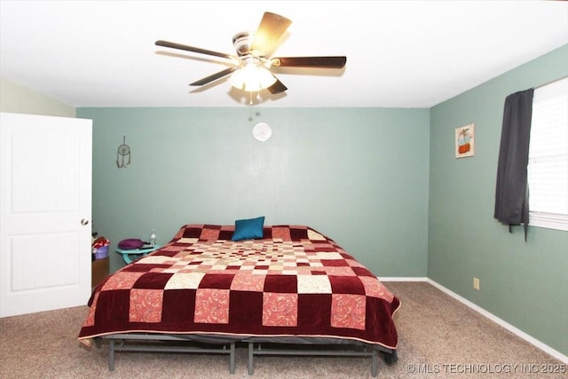410 Shawnee St, So Coffeyville, OK 74072 - carpeted bedroom featuring a ceiling fan