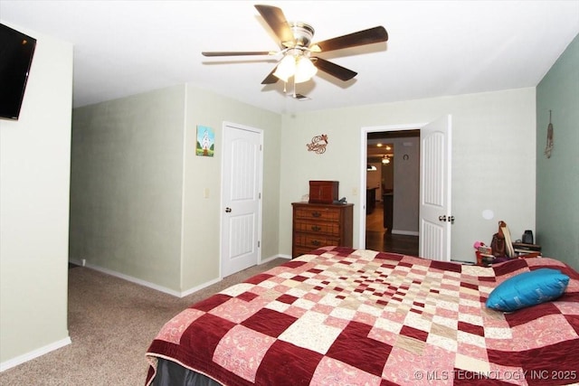 410 Shawnee St, So Coffeyville, OK 74072 - bedroom with carpet, ceiling fan, and baseboards