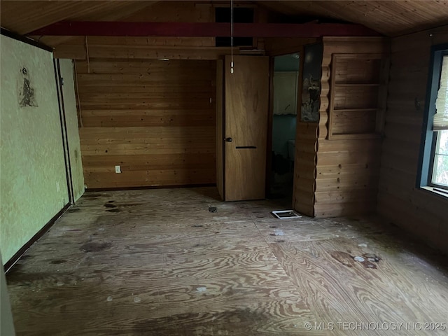 98 Whispering Pines Ln, Stigler, OK 74462 - empty room with vaulted ceiling and wooden walls