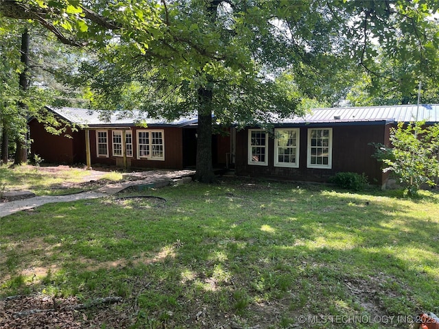 98 Whispering Pines Ln, Stigler, OK 74462 - single story home with a front yard and metal roof