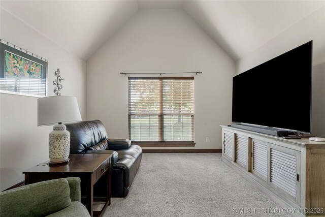 6601 E 85th St, Owasso, OK 74055 - carpeted living room featuring vaulted ceiling and baseboards