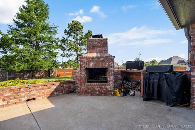 6601 E 85th St, Owasso, OK 74055 - view of patio with an outdoor brick fireplace
