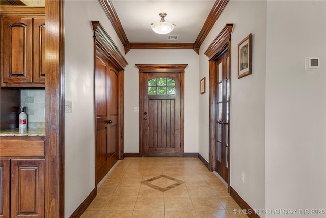 6601 E 85th St, Owasso, OK 74055 - entryway with ornamental molding, light tile patterned floors, baseboards, and french doors
