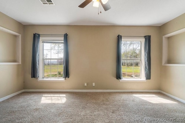 9012 S 49th W Ave, Tulsa, OK 74131 - empty room with carpet, plenty of natural light, and ceiling fan