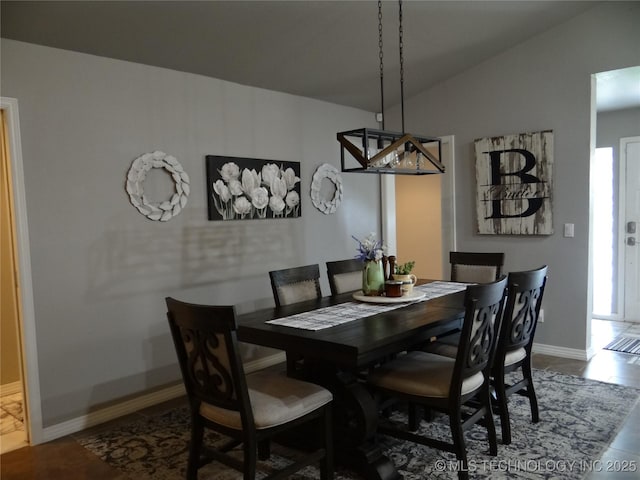 1105 Ono Ct, Mcalester, OK 74501 - dining room featuring vaulted ceiling and baseboards