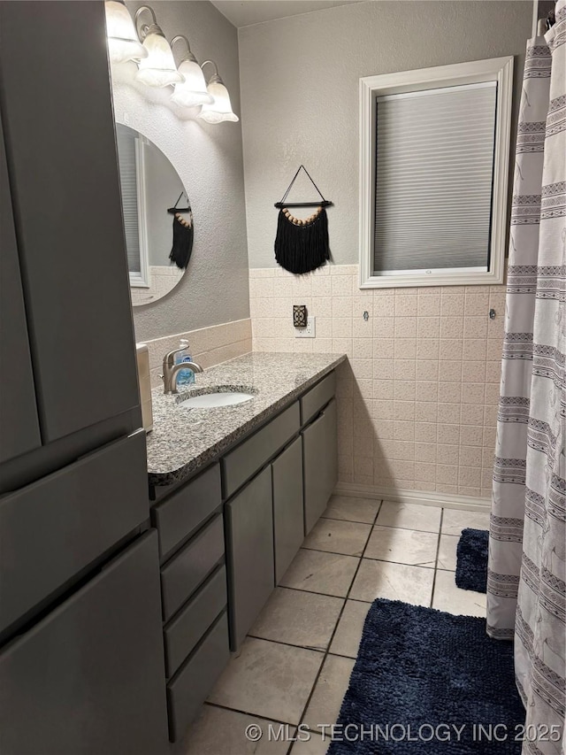 1105 Ono Ct, Mcalester, OK 74501 - bathroom with vanity, tile patterned flooring, and tile walls