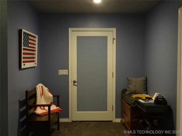 1105 Ono Ct, Mcalester, OK 74501 - doorway with dark colored carpet and baseboards