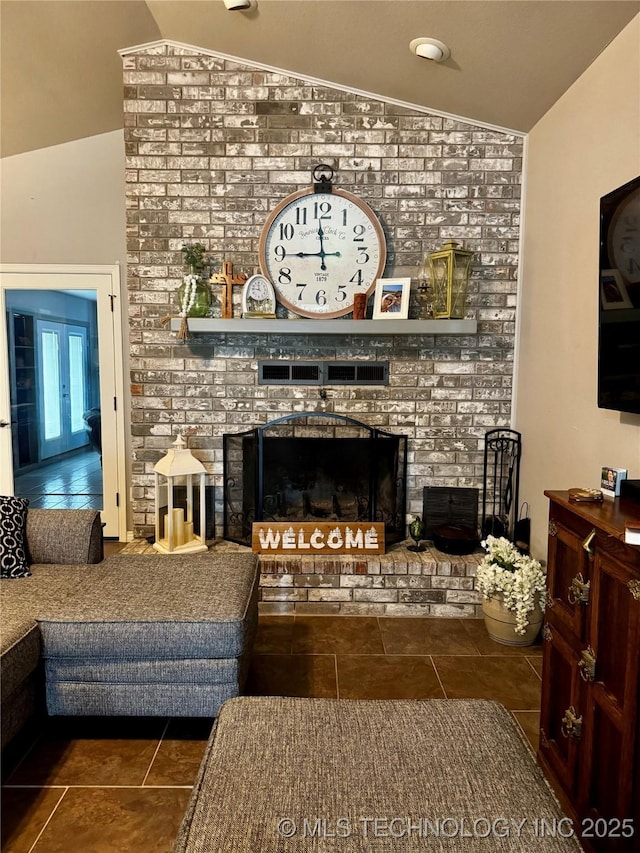 1105 Ono Ct, Mcalester, OK 74501 - tiled living area featuring lofted ceiling, a brick fireplace, and brick wall