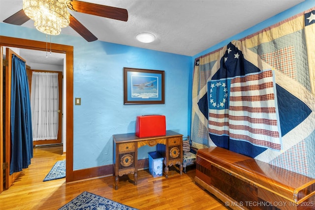 722 E 18th St, Ada, OK 74820 - office with a ceiling fan, wood finished floors, a textured ceiling, baseboards, and a textured wall