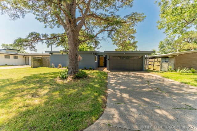 5726 E 26th St, Tulsa, OK 74114 - mid-century inspired home with driveway and an attached garage