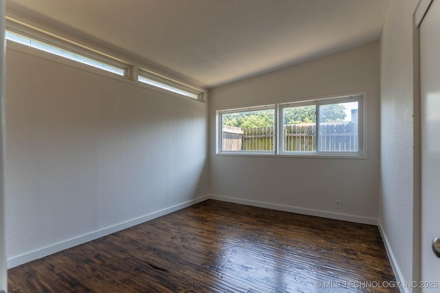 5726 E 26th St, Tulsa, OK 74114 - spare room with dark wood-type flooring and baseboards
