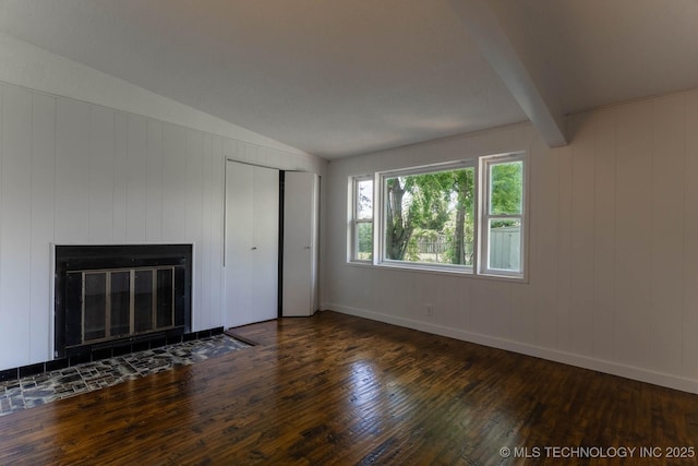 5726 E 26th St, Tulsa, OK 74114 - unfurnished living room featuring wood-type flooring, lofted ceiling, a fireplace with flush hearth, and baseboards