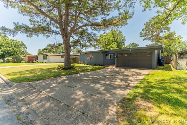 5726 E 26th St, Tulsa, OK 74114 - view of front facade with driveway and an attached garage