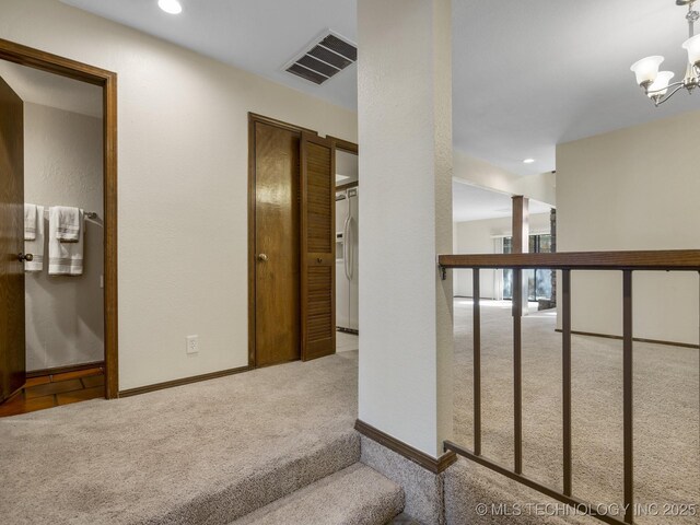 2806 E 84th St Unit 3, Tulsa, OK 74137 - corridor featuring carpet flooring, a chandelier, recessed lighting, and baseboards