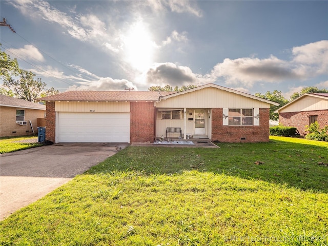 1412 S 9th, Mcalester, OK 74501 - view of front facade with brick siding, driveway, and a front lawn