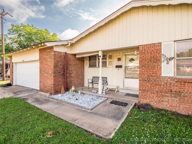 1412 S 9th, Mcalester, OK 74501 - view of front of house with a porch, brick siding, and a garage