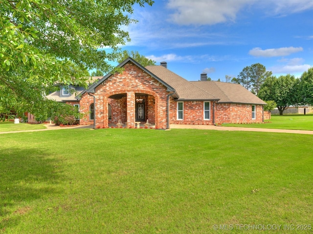 23240 E 90th St S, Broken Arrow, OK 74014 - view of front facade with brick siding, a front lawn, a chimney, and a shingled roof