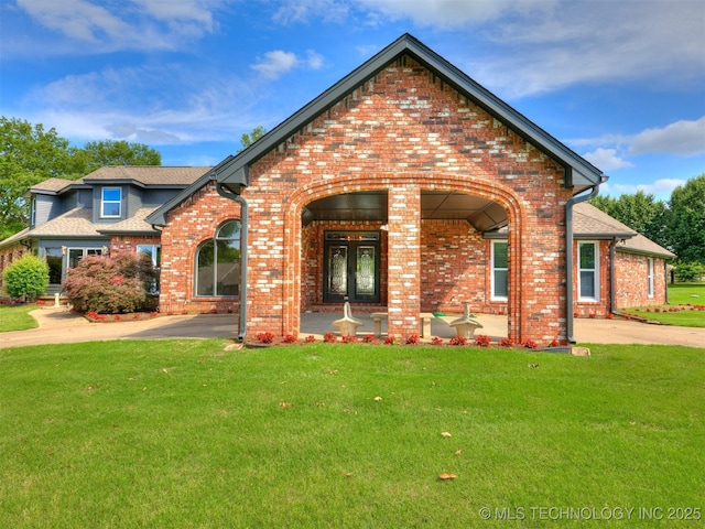 23240 E 90th St S, Broken Arrow, OK 74014 - view of front of property with brick siding, a front lawn, and french doors