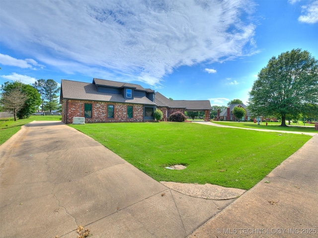 23240 E 90th St S, Broken Arrow, OK 74014 - traditional-style home featuring a front lawn and brick siding