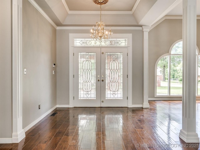23240 E 90th St S, Broken Arrow, OK 74014 - entryway with a raised ceiling, a chandelier, dark wood-style flooring, baseboards, and crown molding