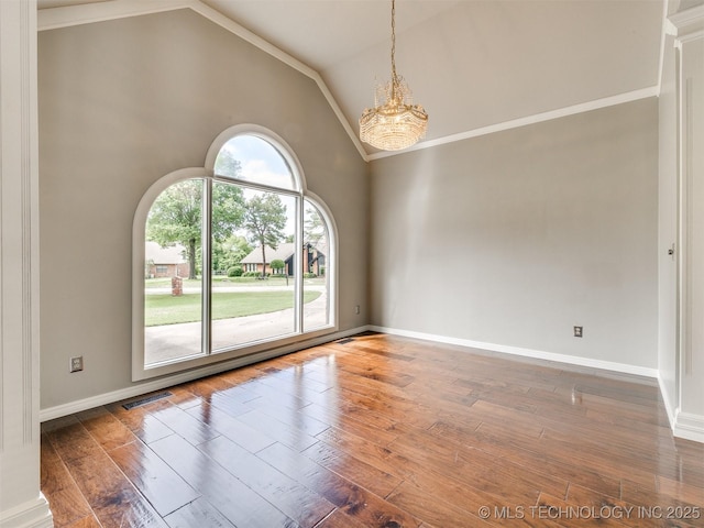 23240 E 90th St S, Broken Arrow, OK 74014 - spare room with a chandelier, hardwood / wood-style floors, high vaulted ceiling, and baseboards