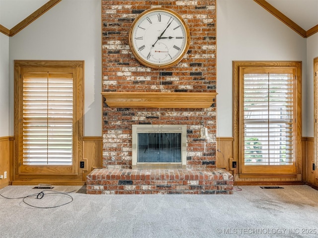 23240 E 90th St S, Broken Arrow, OK 74014 - unfurnished living room with lofted ceiling, a wainscoted wall, carpet, ornamental molding, and a brick fireplace
