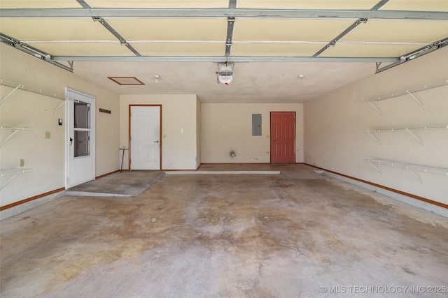 15 W Ridge Way, Bristow, OK 74010 - garage featuring electric panel, a garage door opener, and baseboards