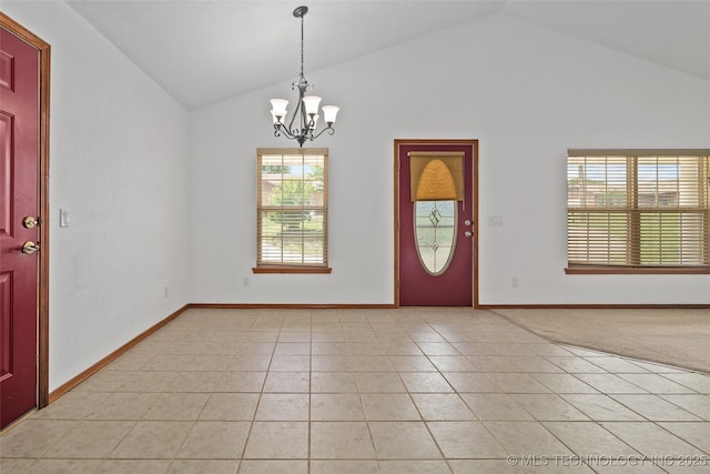 15 W Ridge Way, Bristow, OK 74010 - entrance foyer featuring lofted ceiling, plenty of natural light, a chandelier, light tile patterned flooring, and baseboards