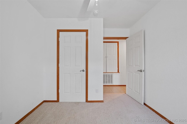 15 W Ridge Way, Bristow, OK 74010 - unfurnished bedroom featuring baseboards, carpet flooring, and a ceiling fan