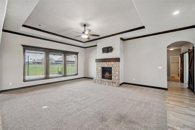 9015 N 65th E Pl, Owasso, OK 74055 - unfurnished living room with ornamental molding, a raised ceiling, ceiling fan, and baseboards
