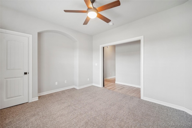 9015 N 65th E Pl, Owasso, OK 74055 - spare room featuring light carpet, a ceiling fan, and baseboards