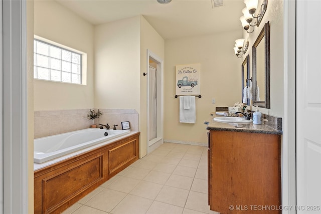 4180 Countyline, Ardmore, OK 73401 - bathroom with double vanity, a garden tub, tile patterned floors, and a stall shower