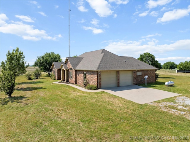 4180 Countyline, Ardmore, OK 73401 - view of front of house featuring concrete driveway, brick siding, a garage, and a front lawn