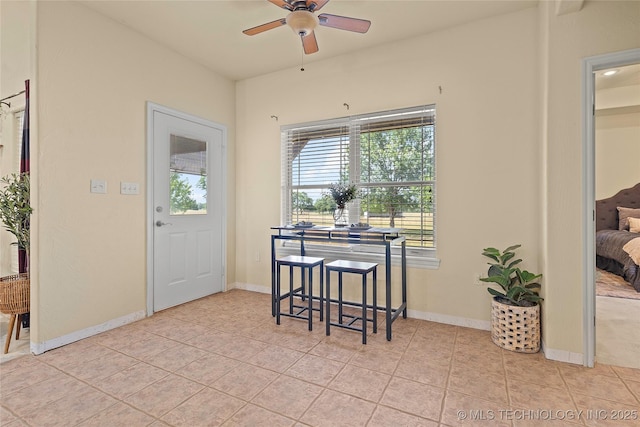 4180 Countyline, Ardmore, OK 73401 - dining room featuring ceiling fan, light tile patterned flooring, and baseboards