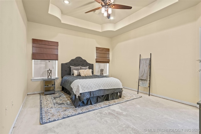 4180 Countyline, Ardmore, OK 73401 - bedroom with concrete flooring, baseboards, recessed lighting, a raised ceiling, and a ceiling fan