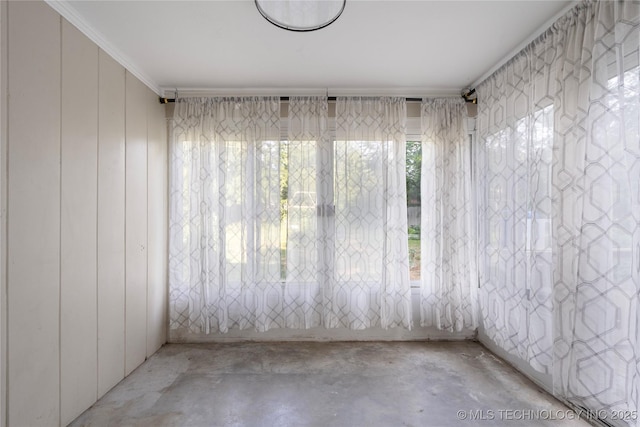 1228 S Erie Ave, Tulsa, OK 74112 - spare room with concrete flooring and ornamental molding
