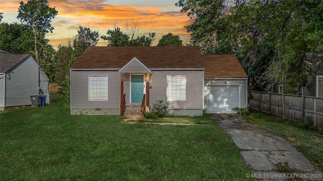 1228 S Erie Ave, Tulsa, OK 74112 - bungalow-style house with crawl space, asphalt driveway, a garage, and entry steps