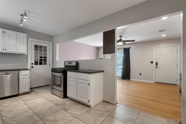 1228 S Erie Ave, Tulsa, OK 74112 - kitchen with appliances with stainless steel finishes, ceiling fan, white cabinets, recessed lighting, and dark countertops