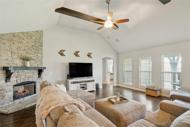 18403 E 50th St, Tulsa, OK 74134 - living area with arched walkways, a ceiling fan, a fireplace, dark wood-type flooring, and high vaulted ceiling