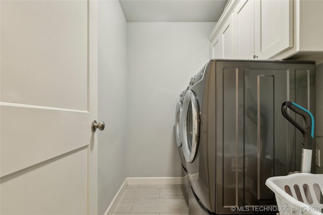 18403 E 50th St, Tulsa, OK 74134 - laundry area with baseboards, washing machine and clothes dryer, and cabinet space