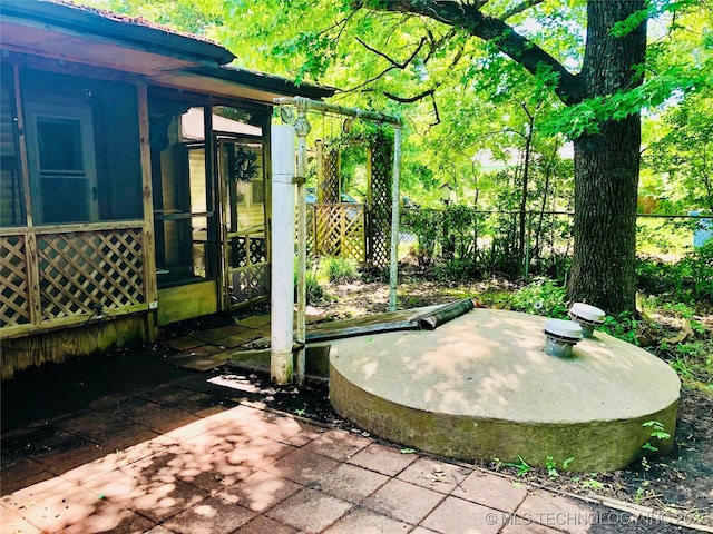 1145 S Little Ave, Cushing, OK 74023 - view of patio featuring a sunroom