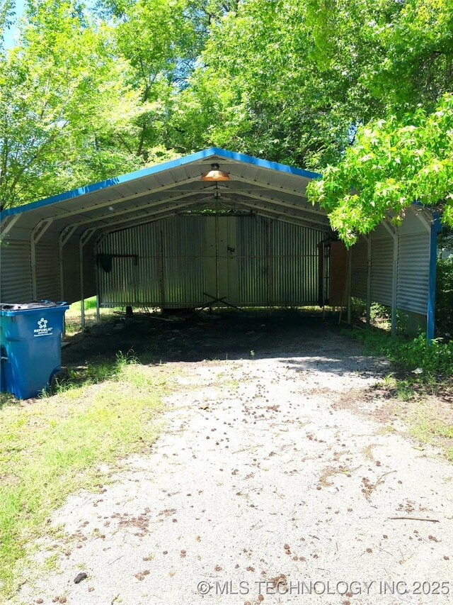 1145 S Little Ave, Cushing, OK 74023 - view of car parking featuring a carport and driveway