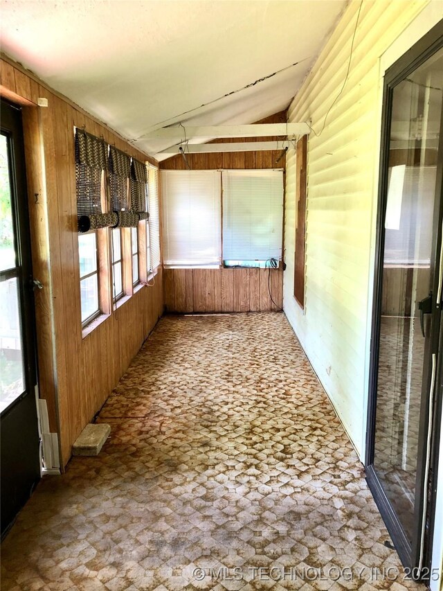 1145 S Little Ave, Cushing, OK 74023 - unfurnished sunroom featuring lofted ceiling