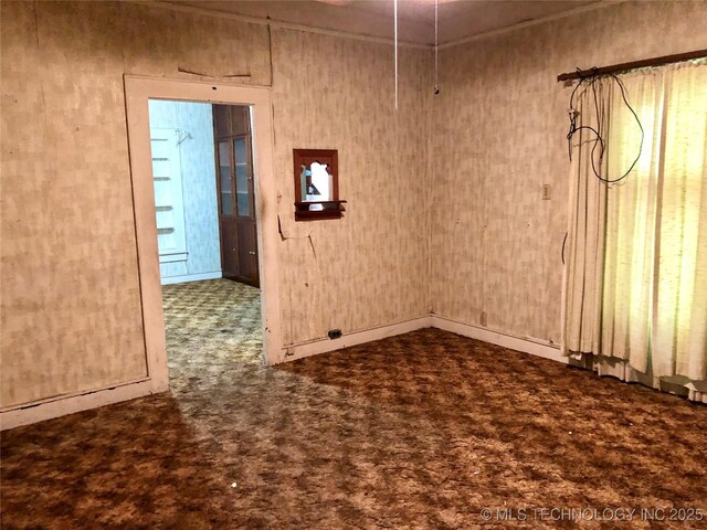1145 S Little Ave, Cushing, OK 74023 - carpeted empty room with baseboards