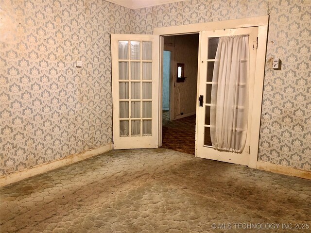 1145 S Little Ave, Cushing, OK 74023 - empty room with wallpapered walls and baseboards