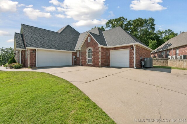 316 E 44th St, Sand Springs, OK 74063 - traditional-style house with a garage, brick siding, concrete driveway, and a shingled roof