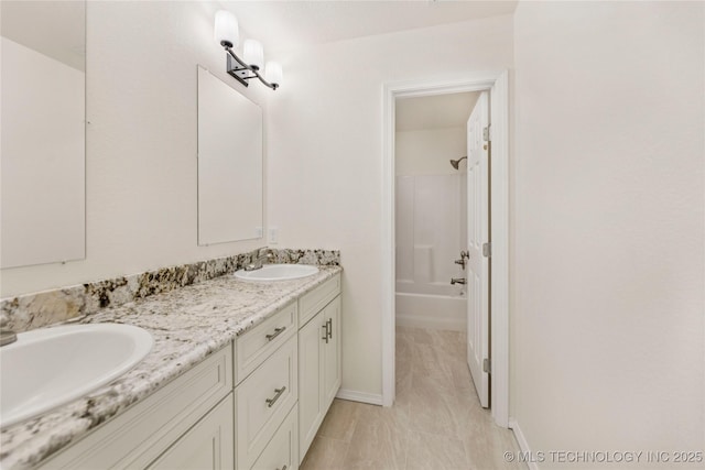 2817 W Oakland St, Broken Arrow, OK 74012 - bathroom with double vanity, shower / bath combination, and baseboards