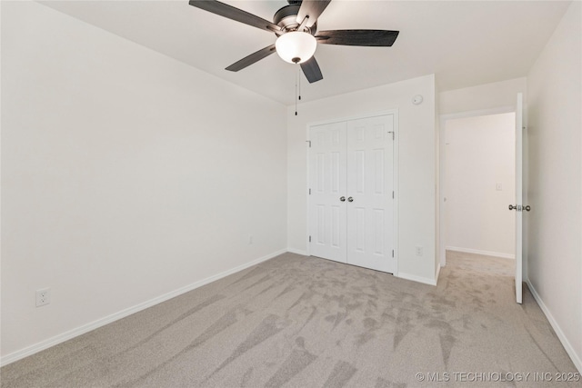 2817 W Oakland St, Broken Arrow, OK 74012 - unfurnished bedroom with carpet, baseboards, a closet, and a ceiling fan