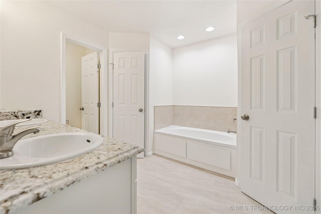 2817 W Oakland St, Broken Arrow, OK 74012 - bathroom featuring double vanity and a garden tub